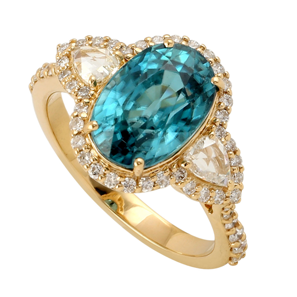 Oval Blue Zirconia & Pear Diamond Halo Ring in 18K Yellow Gold