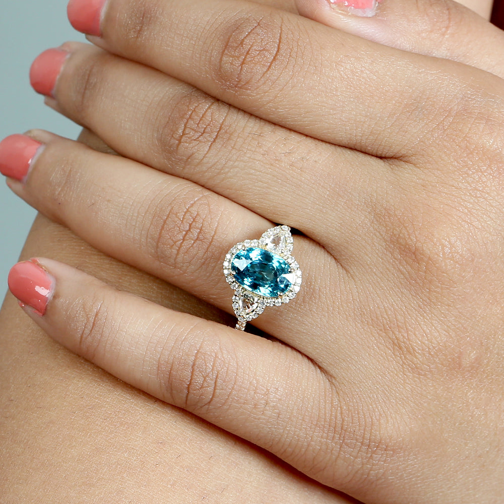 Oval Blue Zirconia & Pear Diamond Halo Ring in 18K Yellow Gold