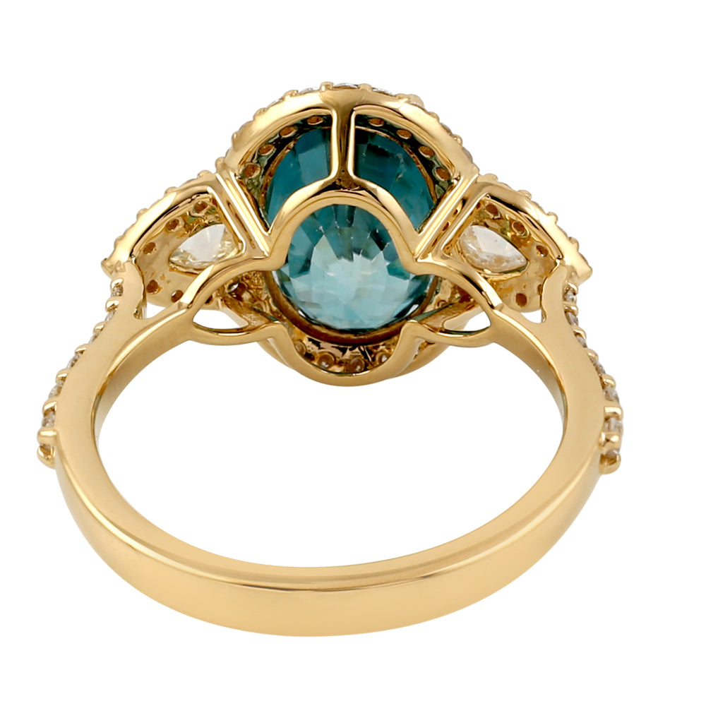Oval Blue Zirconia & Pear Diamond Halo Ring in 18K Yellow Gold