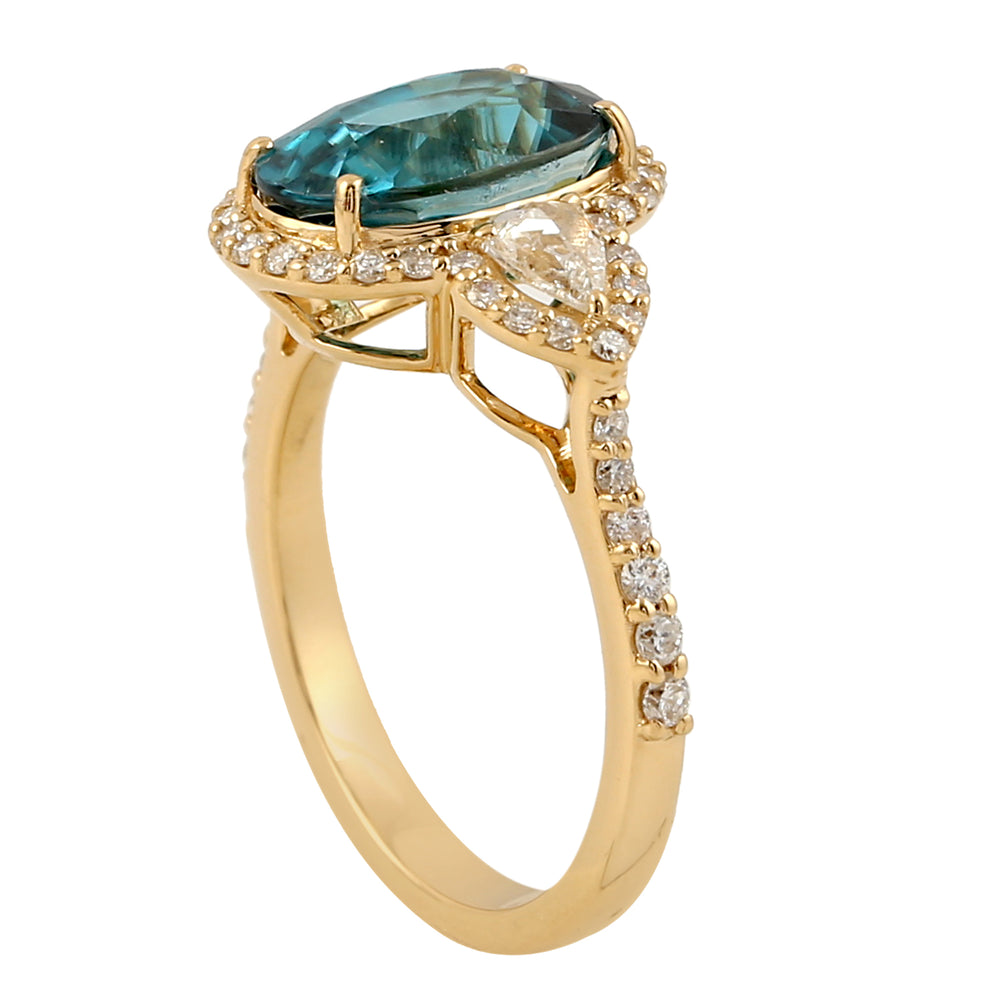 Oval Blue Zirconia & Pear Diamond Halo Ring in 18K Yellow Gold