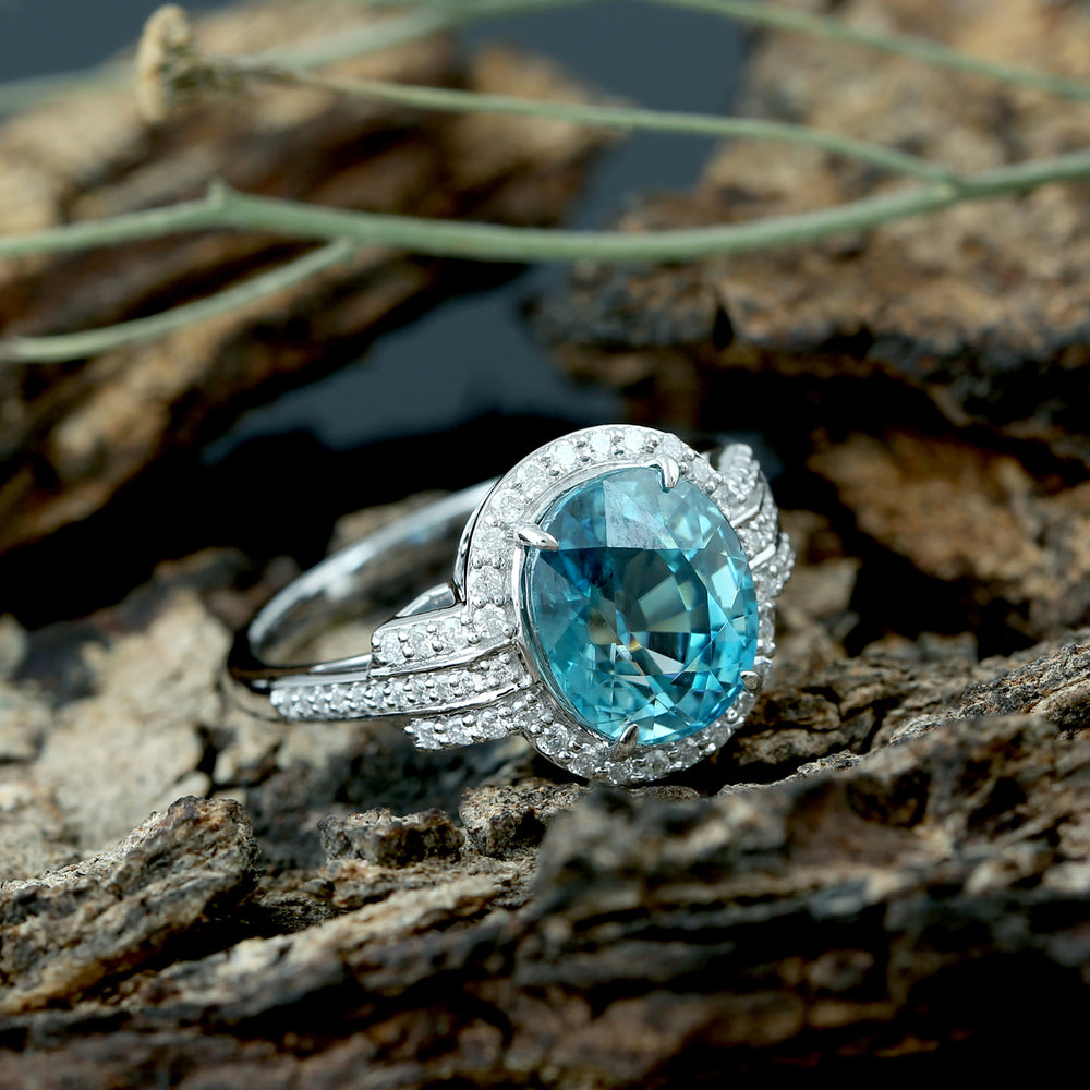 Oval Blue  Zirconia & Diamond Halo Solitaire Ring in 18K White Gold