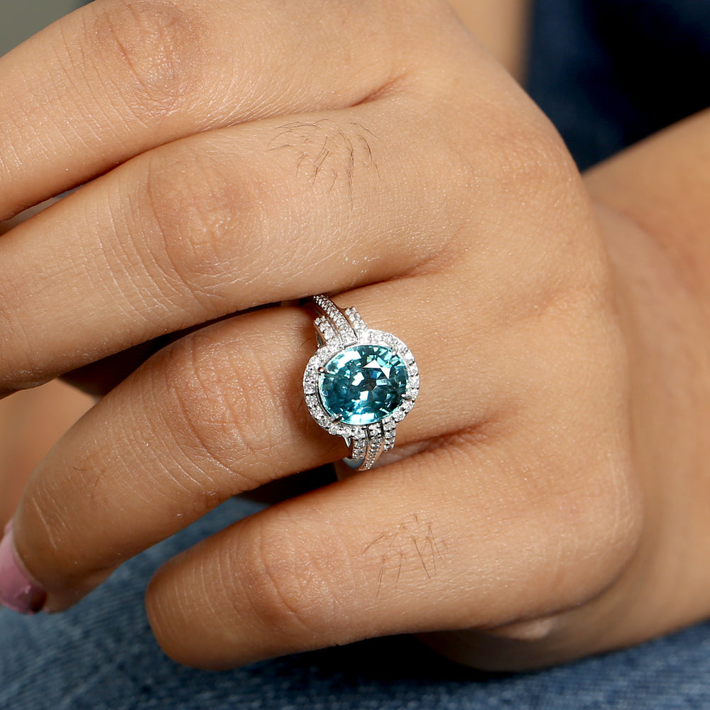 Oval Blue  Zirconia & Diamond Halo Solitaire Ring in 18K White Gold