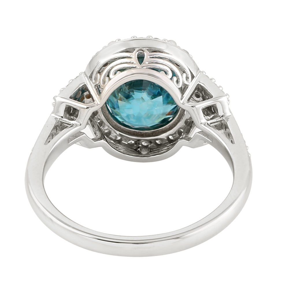 Oval Blue  Zirconia & Diamond Halo Solitaire Ring in 18K White Gold