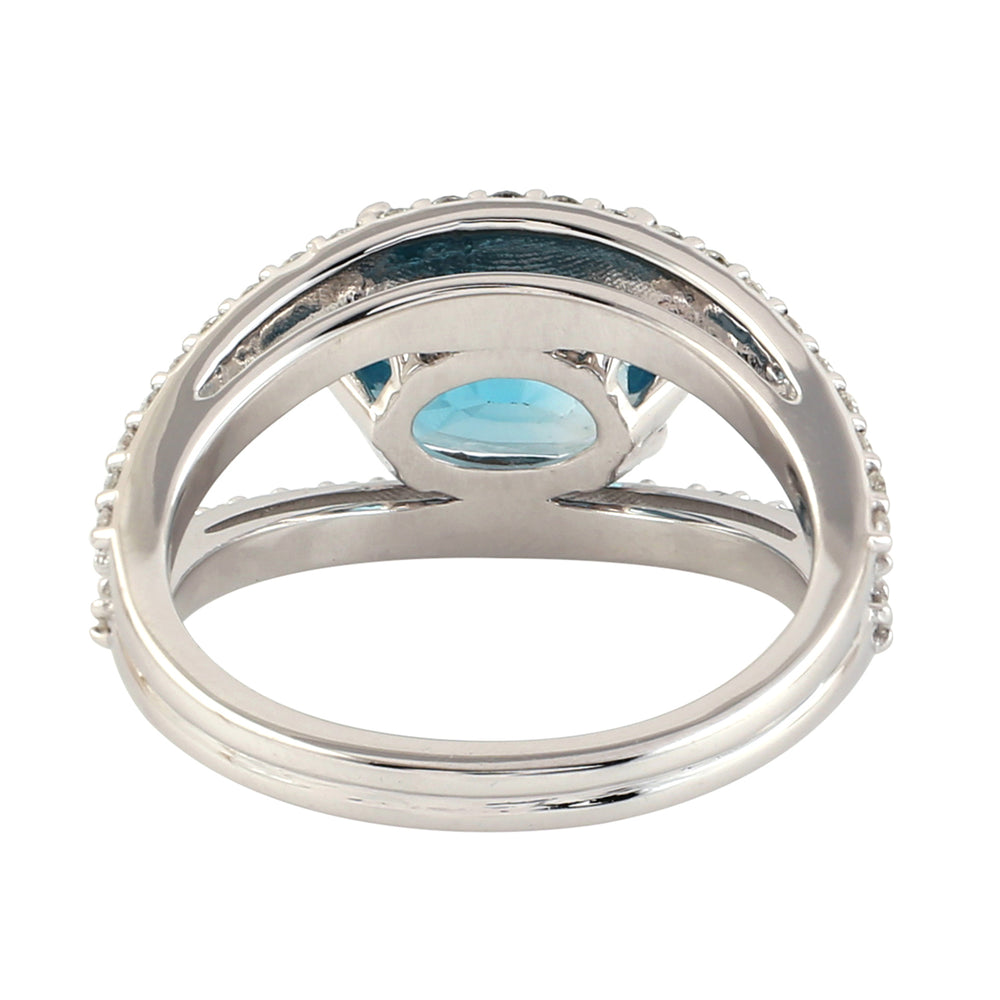 Oval Cut Blue Zircon Solitaire Ring in 18K White Gold with Pave Diamond Halo – Timeless Elegance