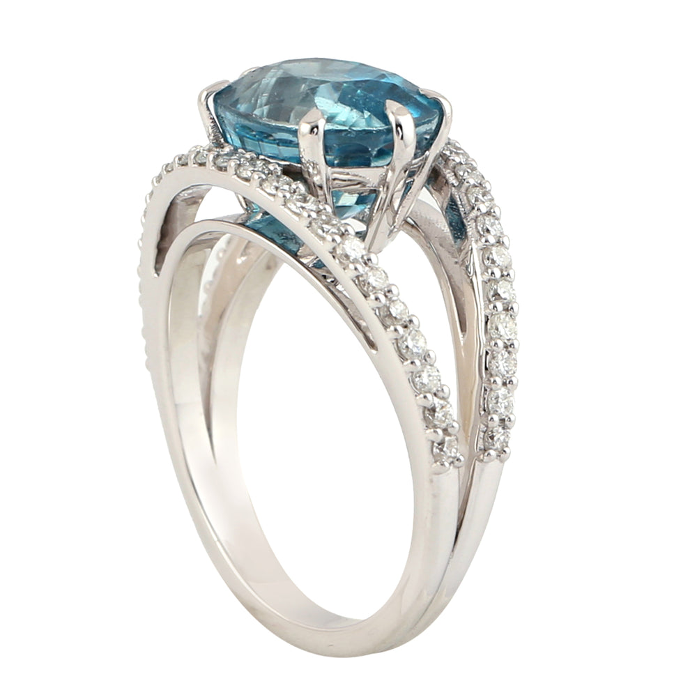 Oval Cut Blue Zircon Solitaire Ring in 18K White Gold with Pave Diamond Halo – Timeless Elegance