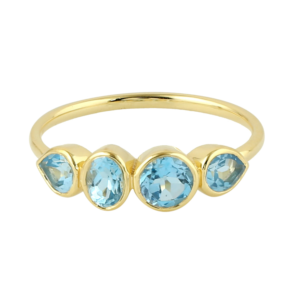Bezel Blue Topaz Four Stone Band Ring In 14K Yellow Gold