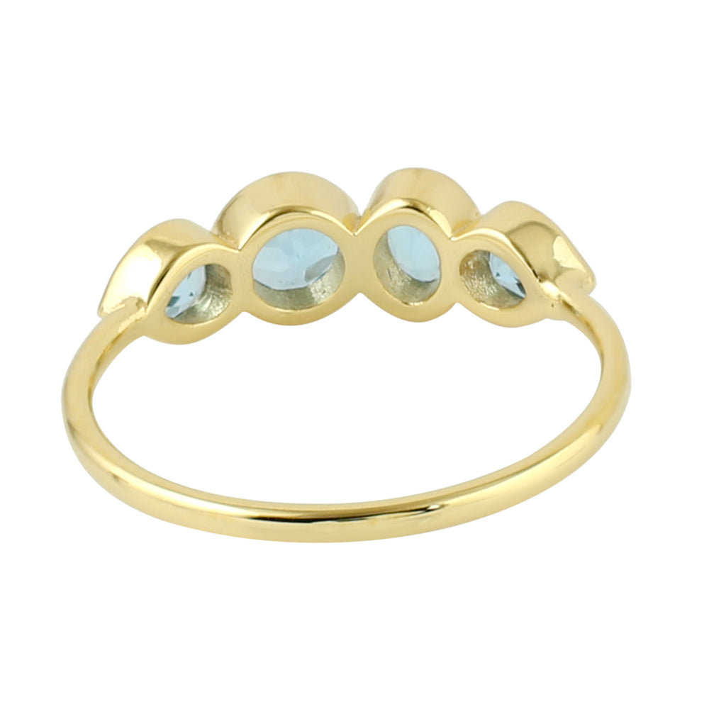 Bezel Blue Topaz Four Stone Band Ring In 14K Yellow Gold