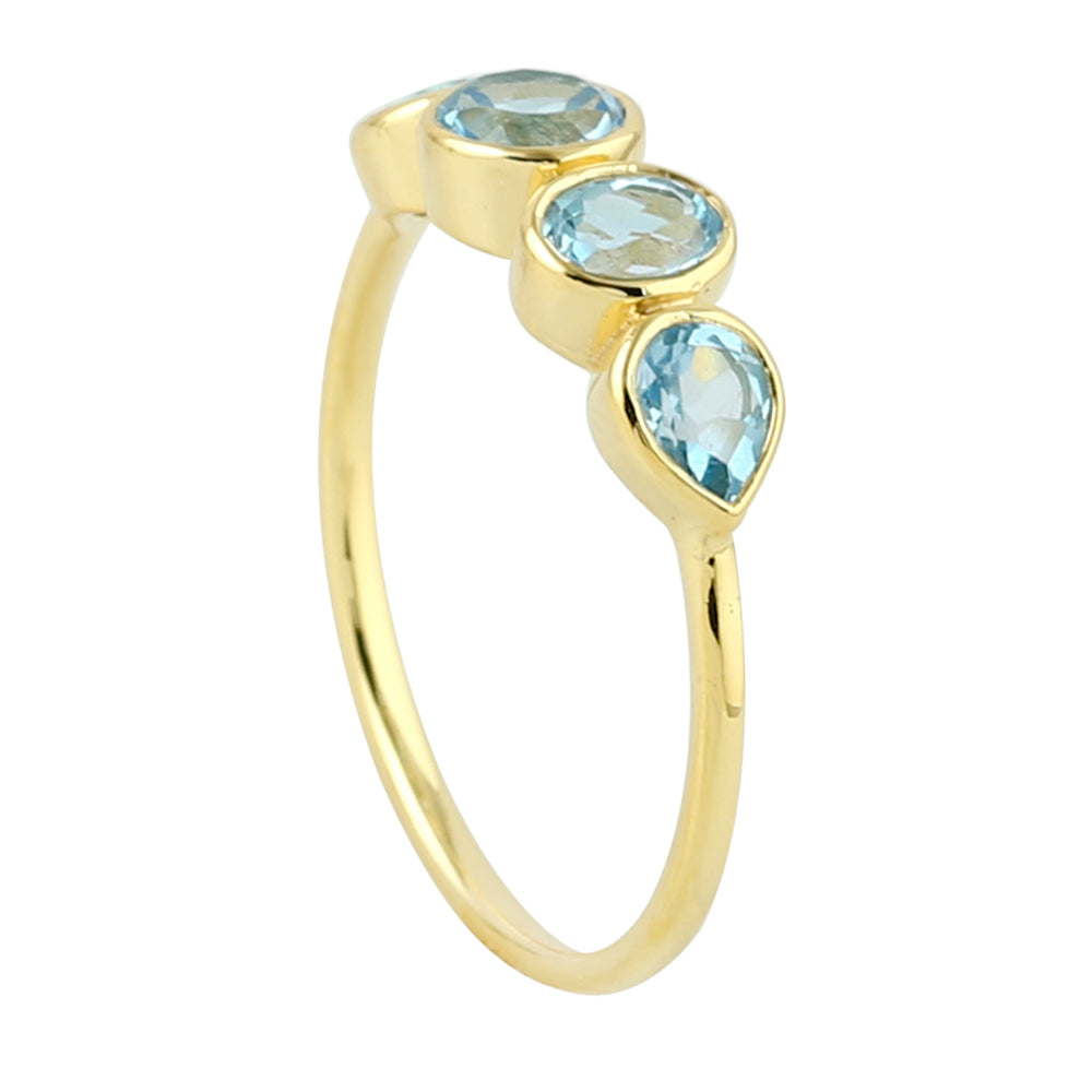 Bezel Blue Topaz Four Stone Band Ring In 14K Yellow Gold