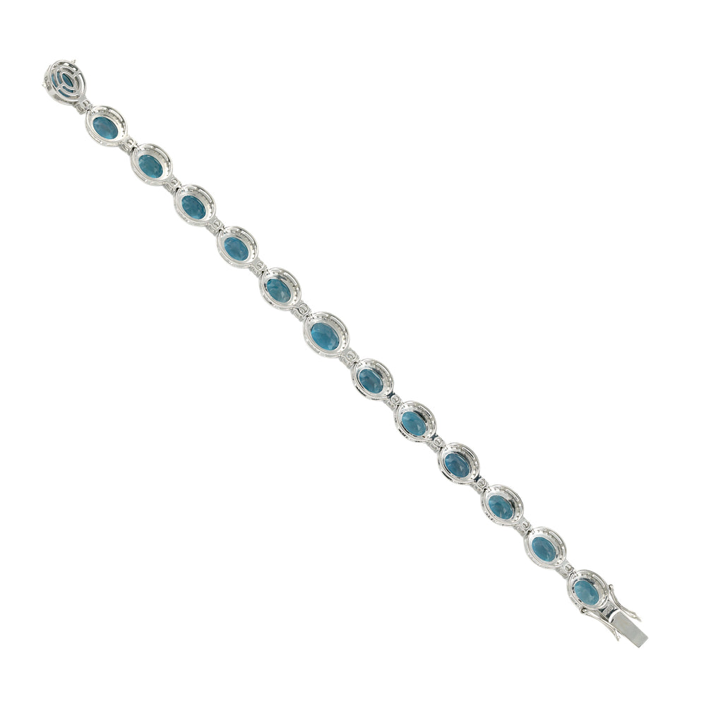 Oval Cut London Blue Topaz Pavé Diamond Fixed and Flexible Bracelet in 14K White Gold