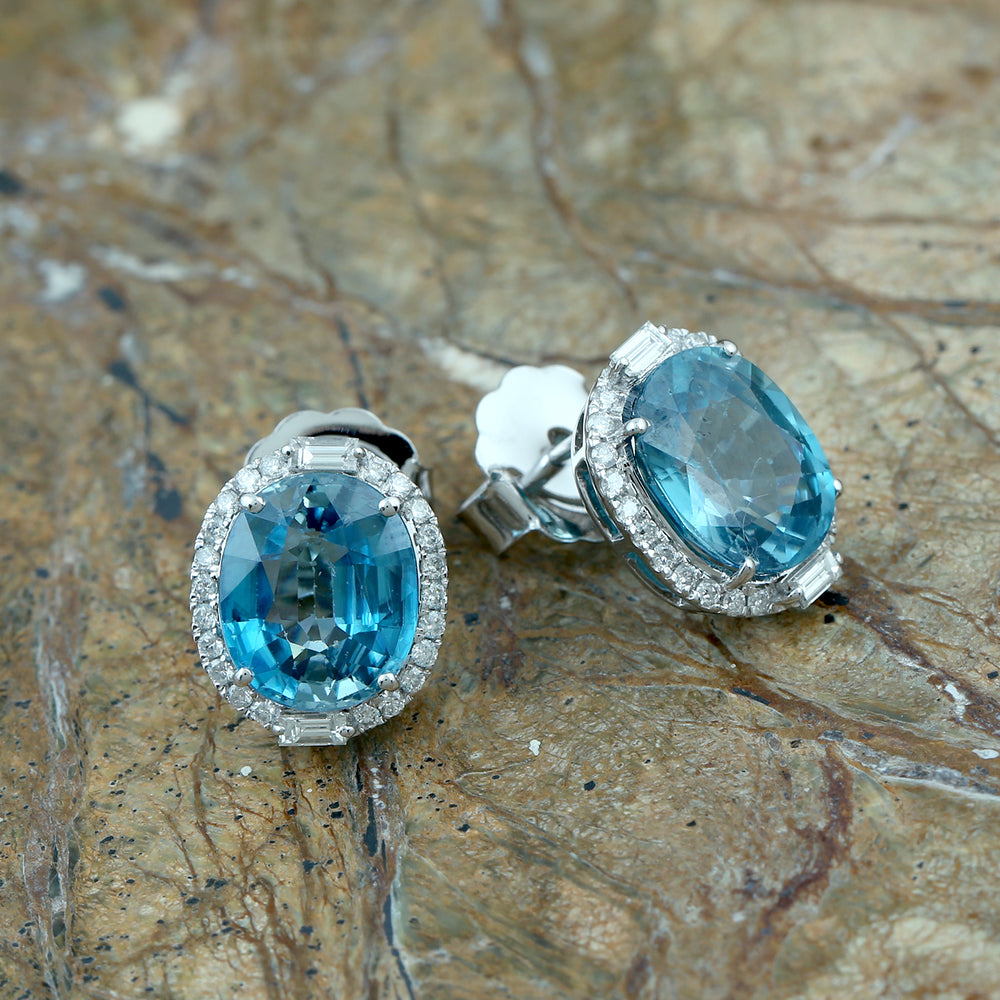 Oval Blue Zirconia & Diamond Halo Stud Earrings in 18K White Gold